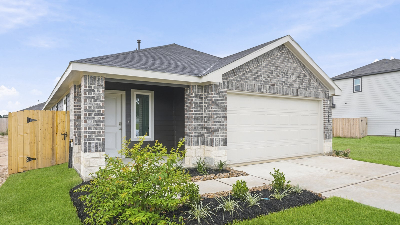 148 Rising Cedar Lane Hockley, TX 77447 - Photo 3 of 14 a front view of a house with garden