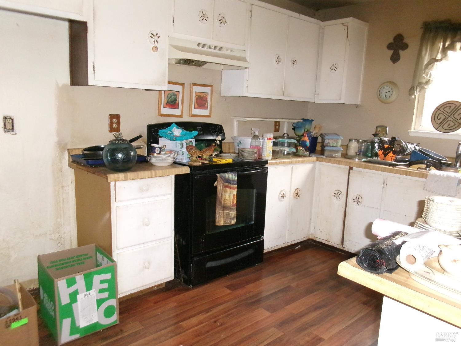 148 Obrien Circle Vallejo, CA 94589 - Photo 6 of 14 a kitchen with stainless steel appliances a stove a sink cabinets and wooden floor