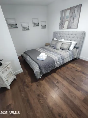 a bedroom with a bed and window