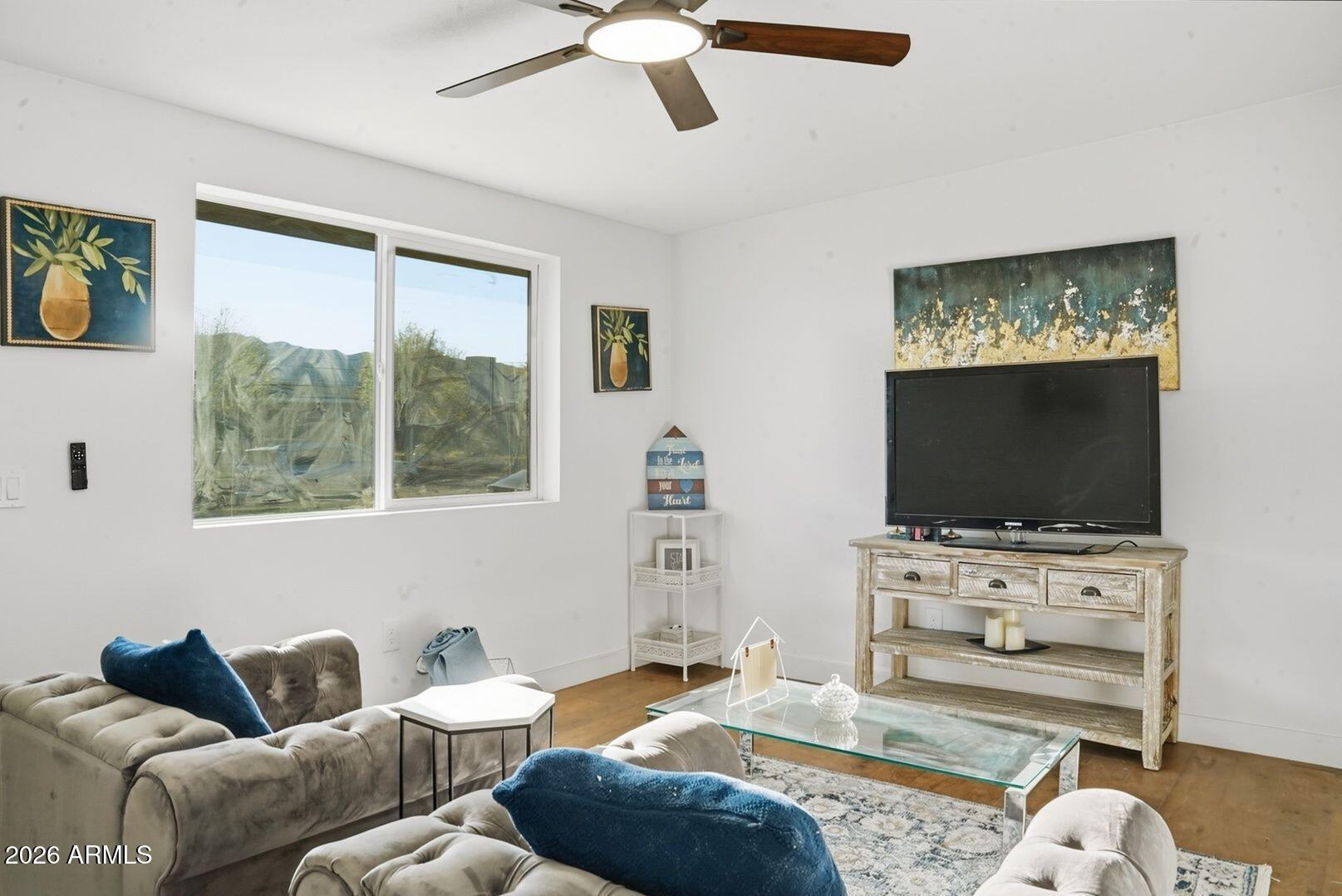 408 Hartford Road Kearny, AZ 85137 - Photo 15 of 27 a living room with furniture and a flat screen tv