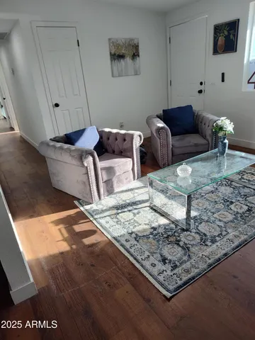a living room with furniture and a rug
