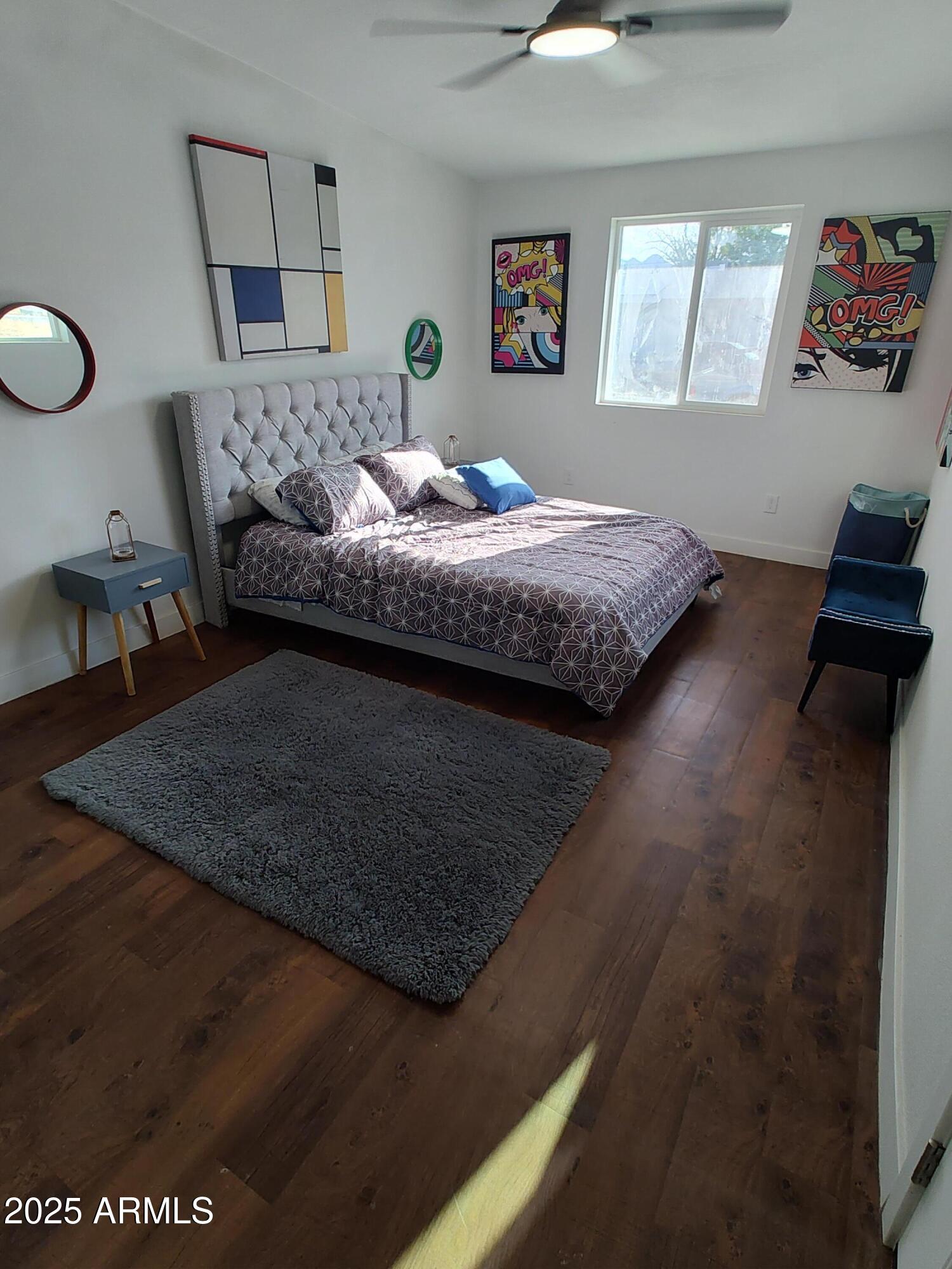 408 Hartford Road Kearny, AZ 85137 - Photo 8 of 20 a bedroom with a bed window and couch