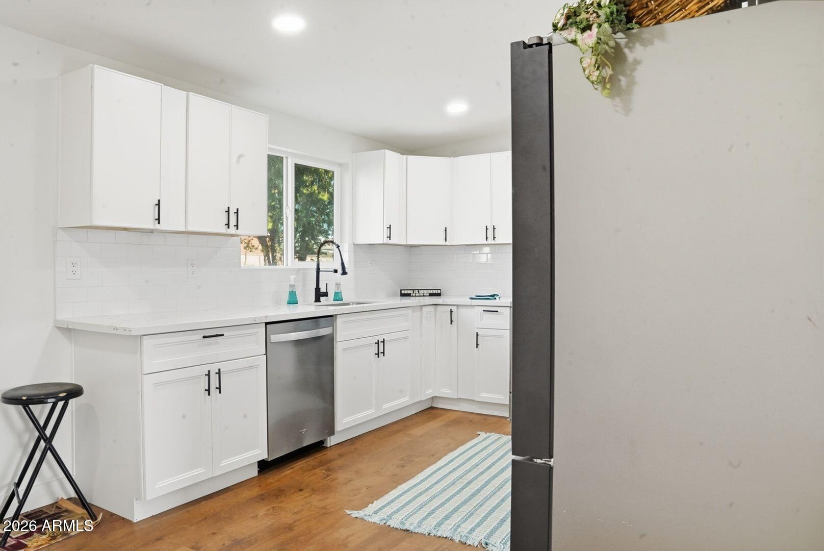 408 Hartford Road Kearny, AZ 85137 - Photo 9 of 27 a kitchen with a sink cabinets and window