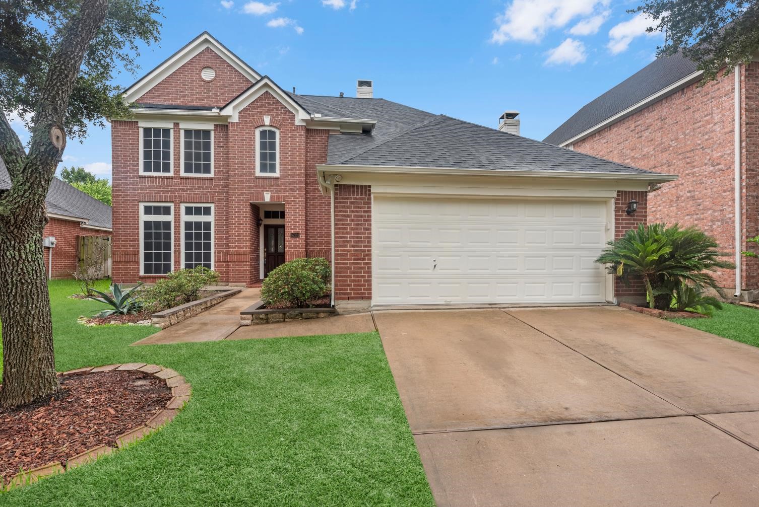5724 Shady Hollow Court Rosharon, TX 77583 - Photo 3 of 27 A striking front elevation with timeless brick, mature landscaping, and natural lighting that creates an inviting first impression. As you approach this part of the cul-de-sac, the setting feels quiet and established, with nearby neighborhood amenities adding to the home’s overall appeal.