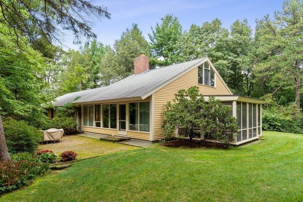 7 Leeland Terrace Lexington, MA 02421 - Photo 1 of 32 a front view of a house with a yard