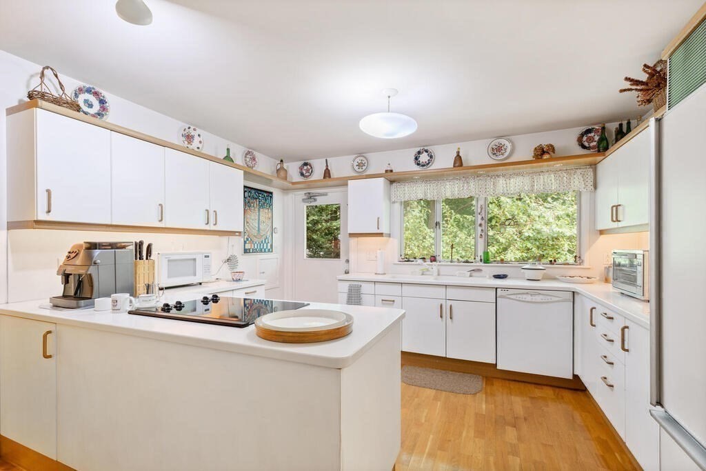 7 Leeland Terrace Lexington, MA 02421 - Photo 11 of 32 a kitchen with granite countertop a sink stove and cabinets