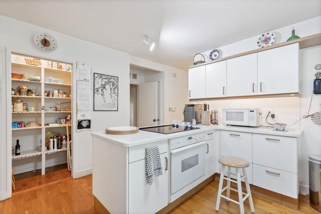 7 Leeland Terrace Lexington, MA 02421 - Photo 13 of 32 a utility room with cabinets washer and dryer