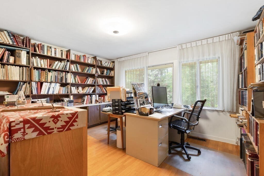 7 Leeland Terrace Lexington, MA 02421 - Photo 16 of 32 a view of a workspace with furniture and a bookshelf
