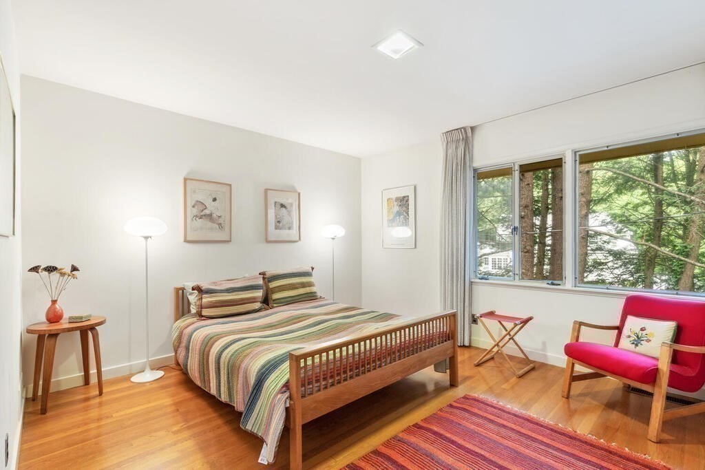 7 Leeland Terrace Lexington, MA 02421 - Photo 19 of 32 a bedroom with a bed and wooden floor