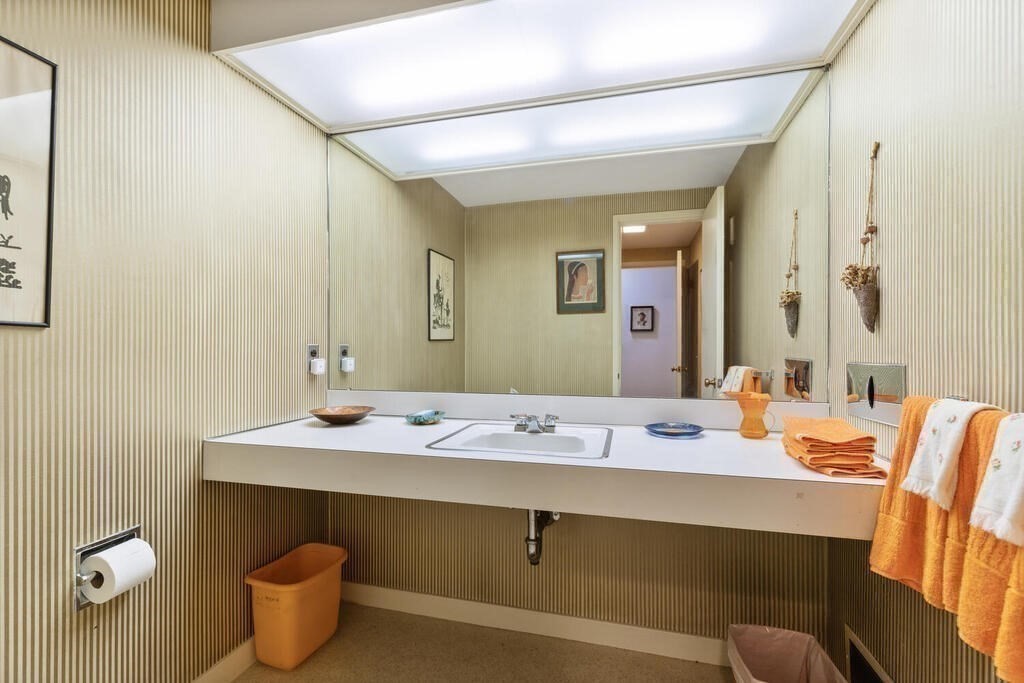 7 Leeland Terrace Lexington, MA 02421 - Photo 20 of 32 a bathroom with a sink and a mirror