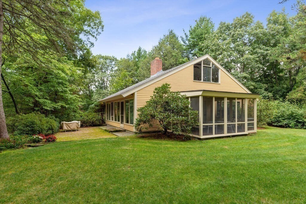 7 Leeland Terrace Lexington, MA 02421 - Photo 2 of 32 a front view of a house with a yard and trees
