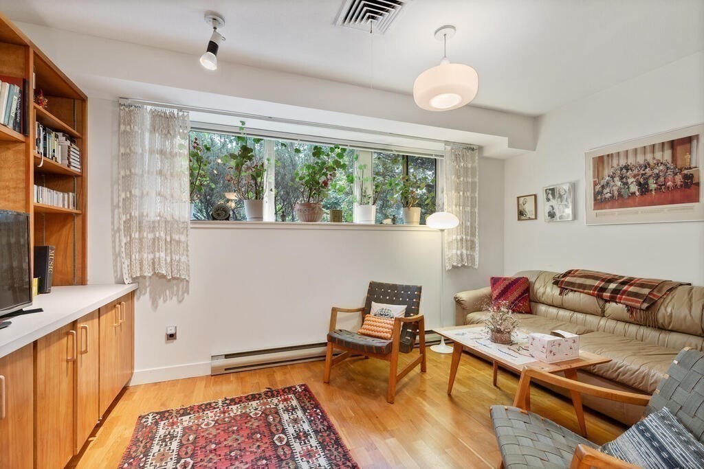 7 Leeland Terrace Lexington, MA 02421 - Photo 25 of 32 a living room with furniture and a flat screen tv