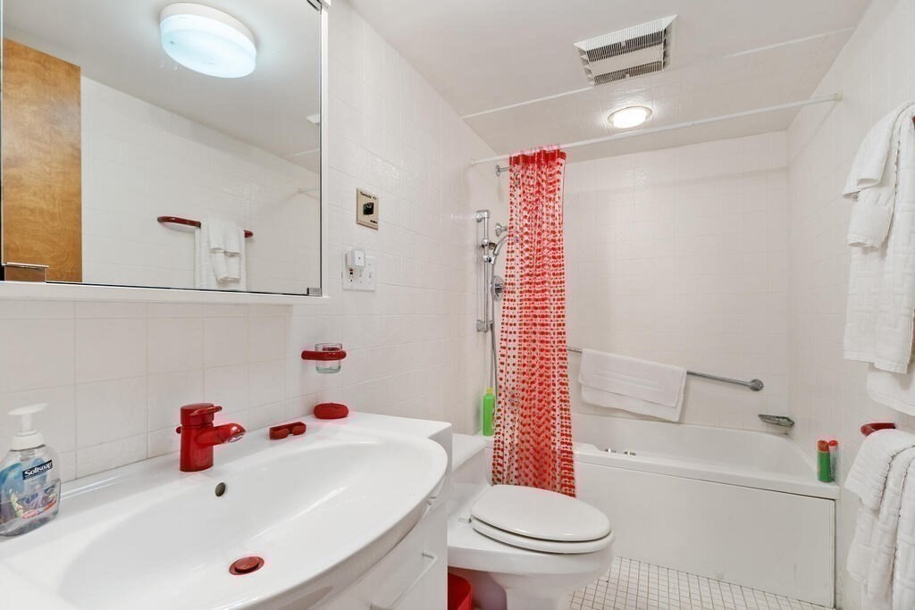 7 Leeland Terrace Lexington, MA 02421 - Photo 26 of 32 a bathroom with a sink a toilet and shower