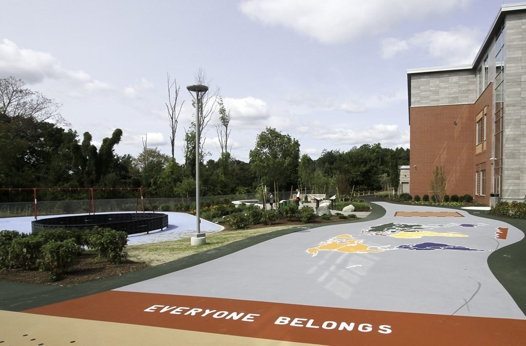 7 Leeland Terrace Lexington, MA 02421 - Photo 29 of 32 a view of a swimming pool with a bench and wooden fence