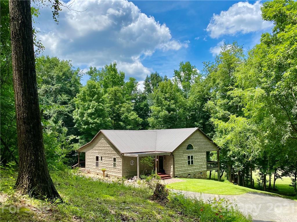 1094 West End Road Chester, SC 29706 - Photo 2 of 37 a view of house that has a lot of plants and trees in it