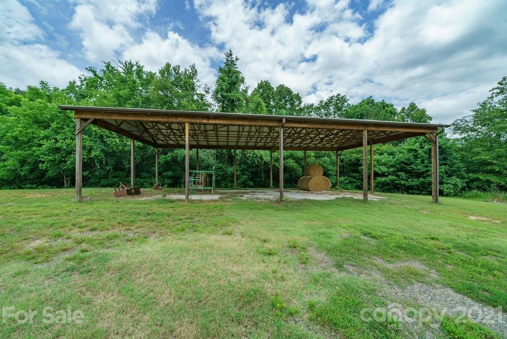 1094 West End Road Chester, SC 29706 - Photo 25 of 37 a view of a yard with a fence and trees