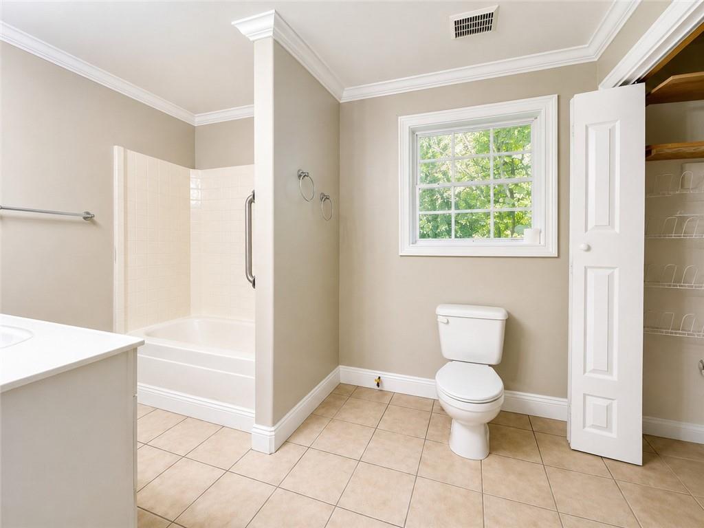 212 Craigtown Road Northeast Calhoun, GA 30701 - Photo 9 of 21 a bathroom with a toilet and a shower