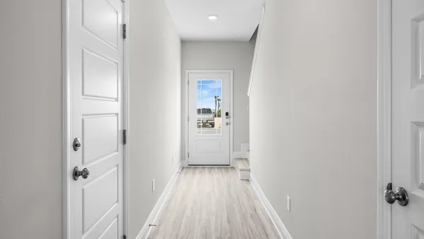 a view of room and wooden floor