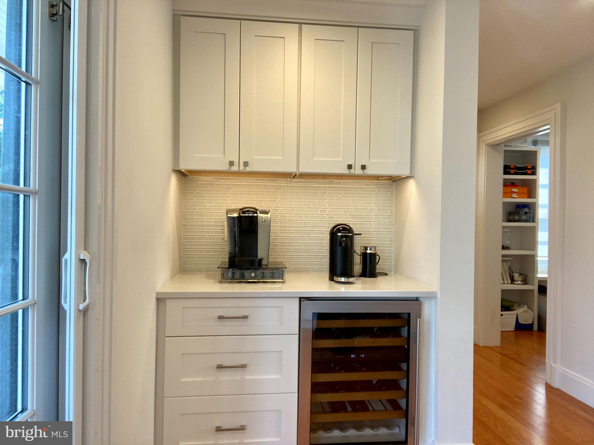 121 Upnor Road Baltimore, MD 21212 - Photo 37 of 79 a kitchen with white cabinets and appliances