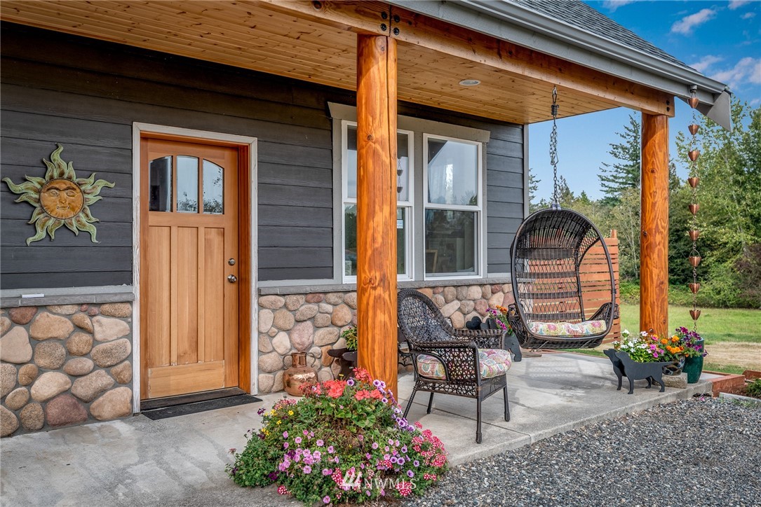 672 East Smith Road Bellingham, WA 98226 - Photo 1 of 25 a front view of a house with outdoor seating