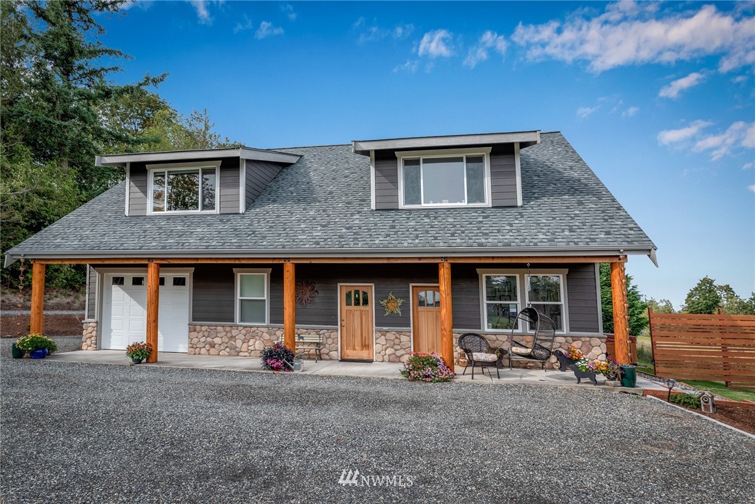 672 East Smith Road Bellingham, WA 98226 - Photo 3 of 25 a front view of a house with patio