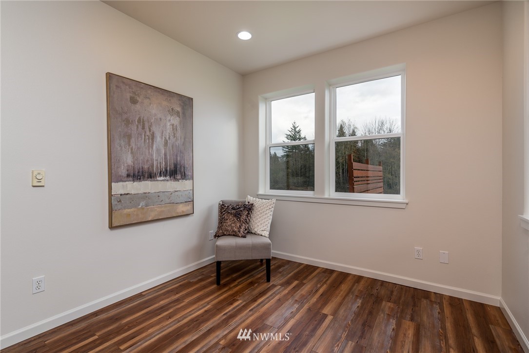 672 East Smith Road Bellingham, WA 98226 - Photo 4 of 25 a bench sitting in a room next to a window