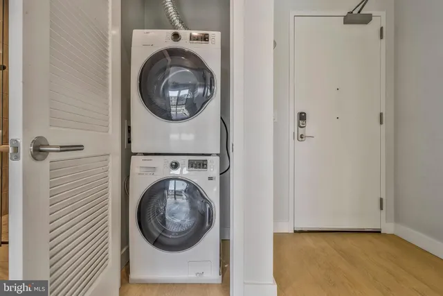 a view of a hallway with washer and dryer