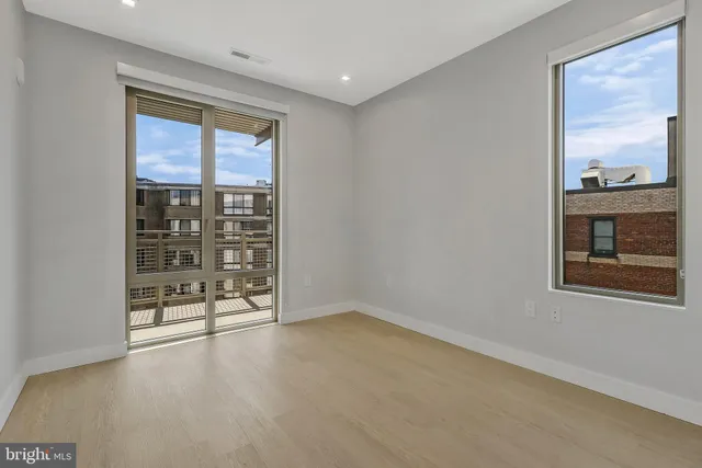 a view of an empty room with a window