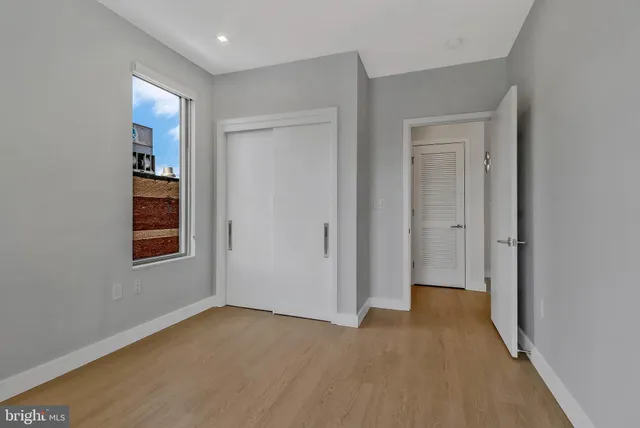 a view of livingroom with hardwood floor and a window
