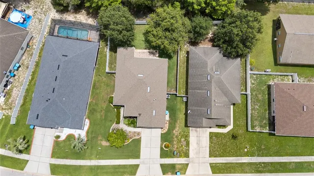 aerial view of a house with a yard