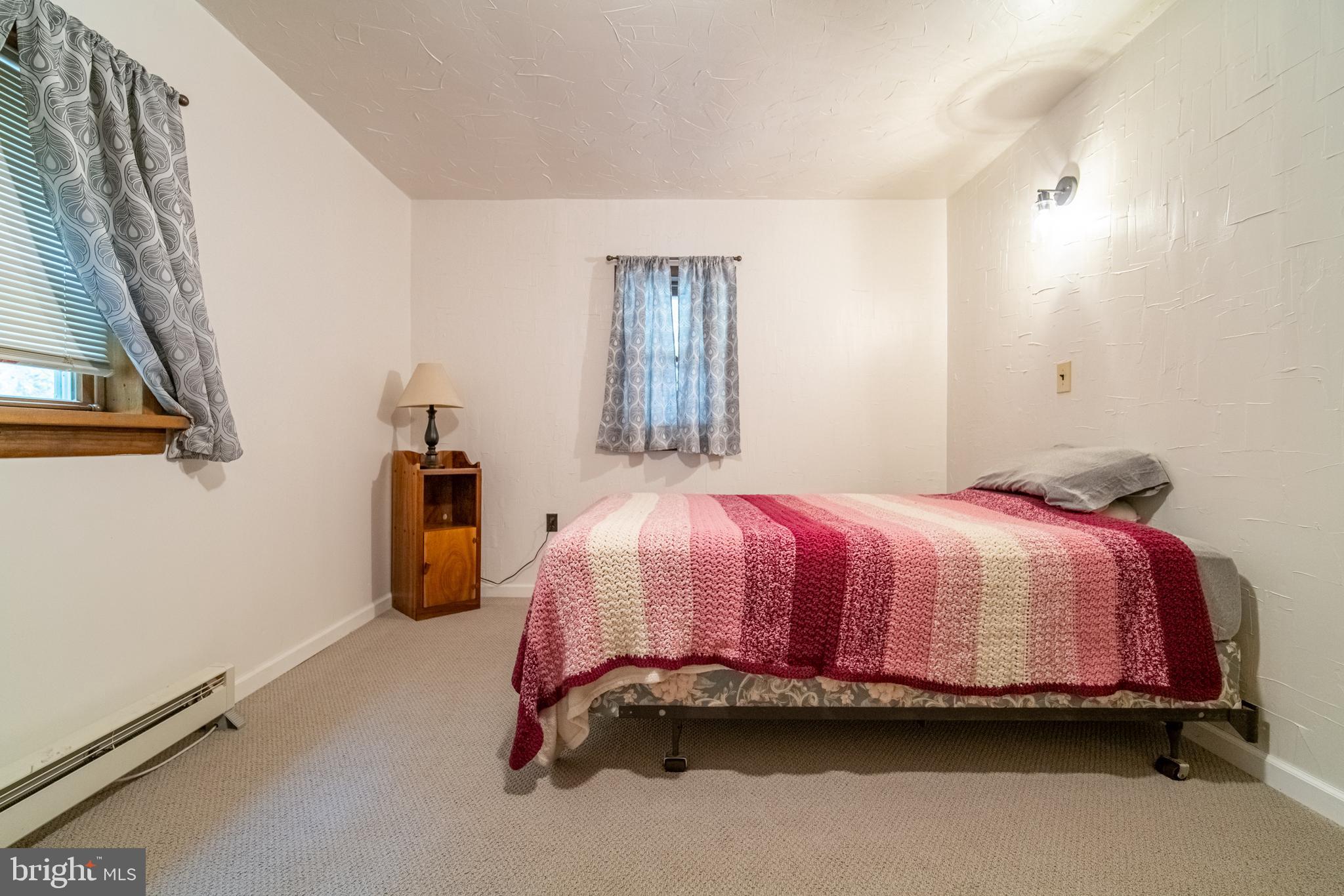 13127 Manor Furnace Road Brogue, PA 17309 - Photo 46 of 78 a bed sitting in a bedroom next to a window