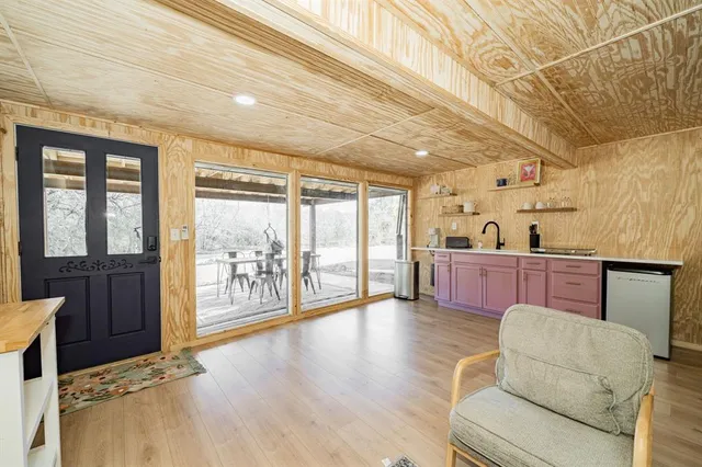 a front view of a house with a yard and sitting area