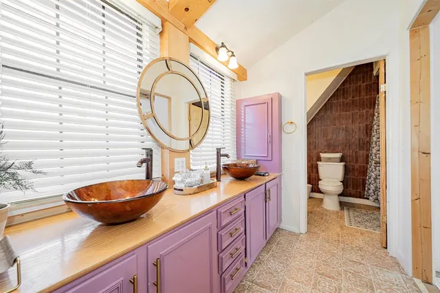 a bathroom with a shower and a toilet