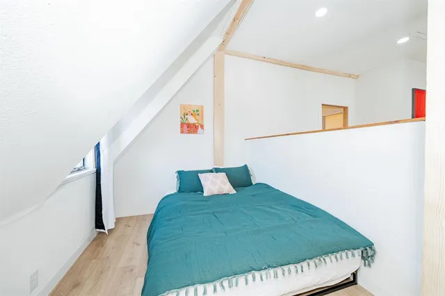 a view of a patio with a table and chairs