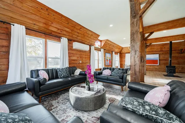 a kitchen with stainless steel appliances granite countertop a stove top oven a sink a counter space and cabinets