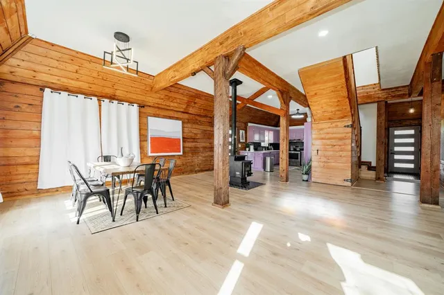 a kitchen with stainless steel appliances granite countertop a sink a stove a microwave a sink and cabinets