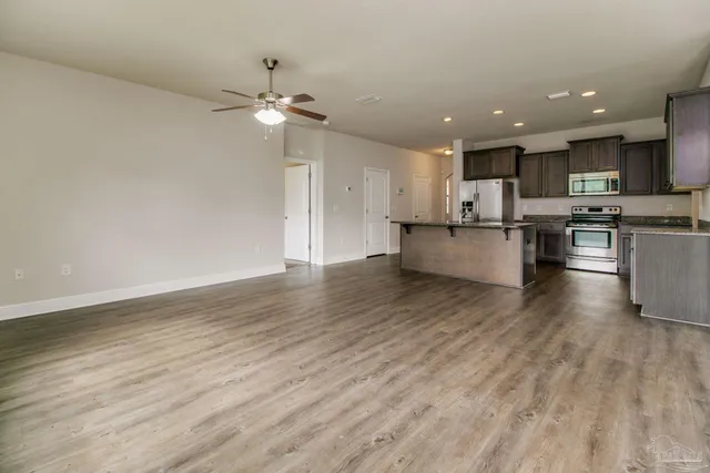 a view of kitchen with wooden floor and a counter top space