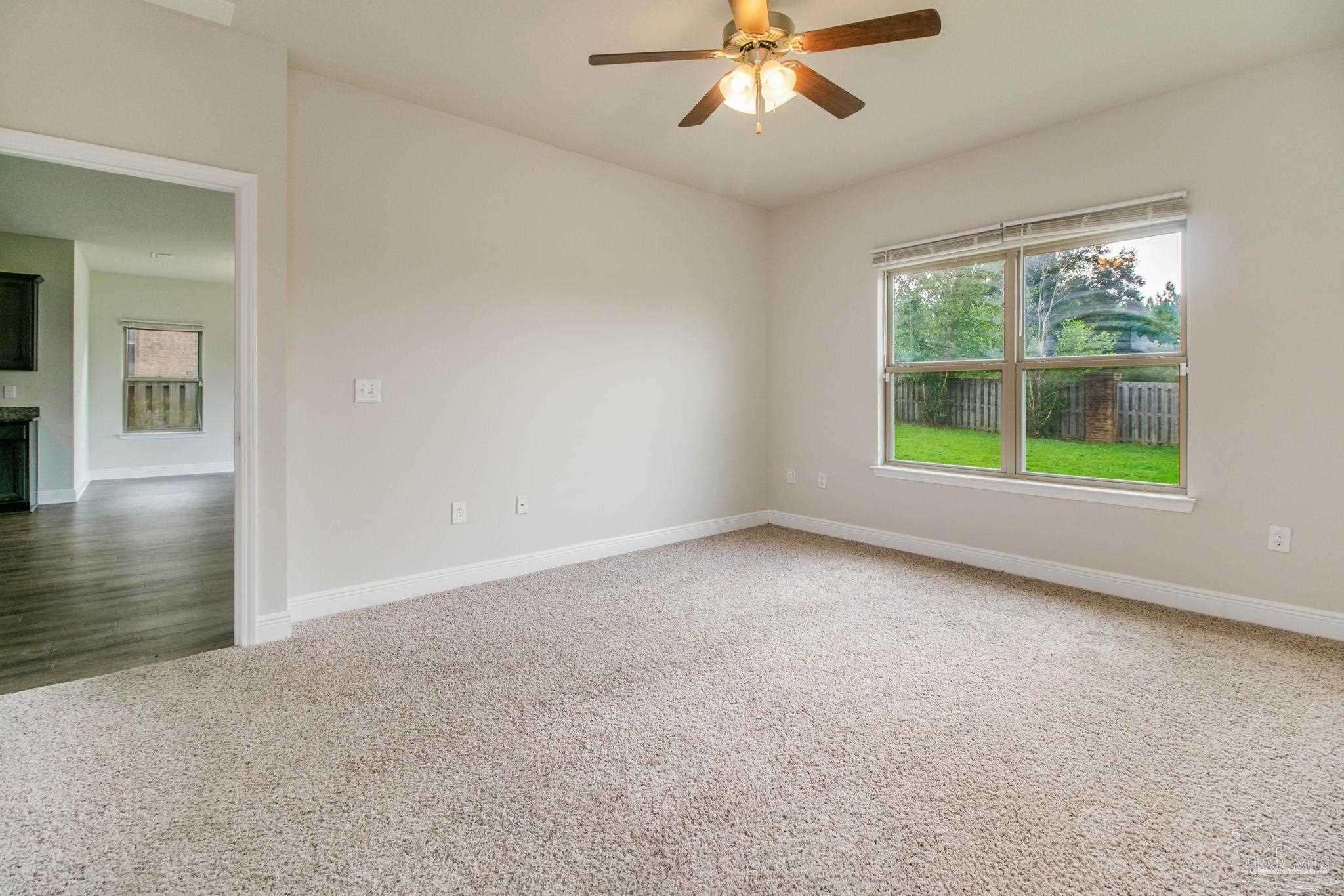 6348 Ladera Trail Pace, FL 32571 - Photo 15 of 50 a view of an empty room with a window