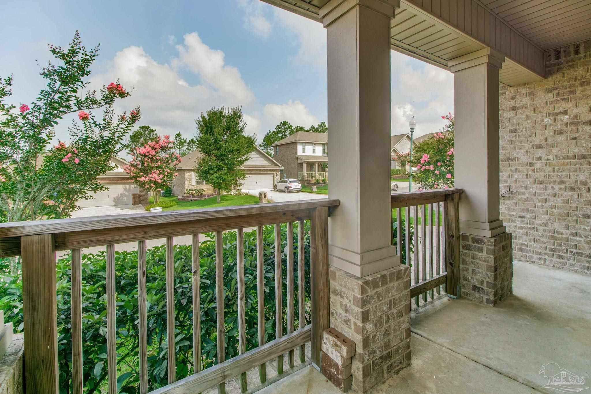 6348 Ladera Trail Pace, FL 32571 - Photo 2 of 50 a view of a balcony with flower plants