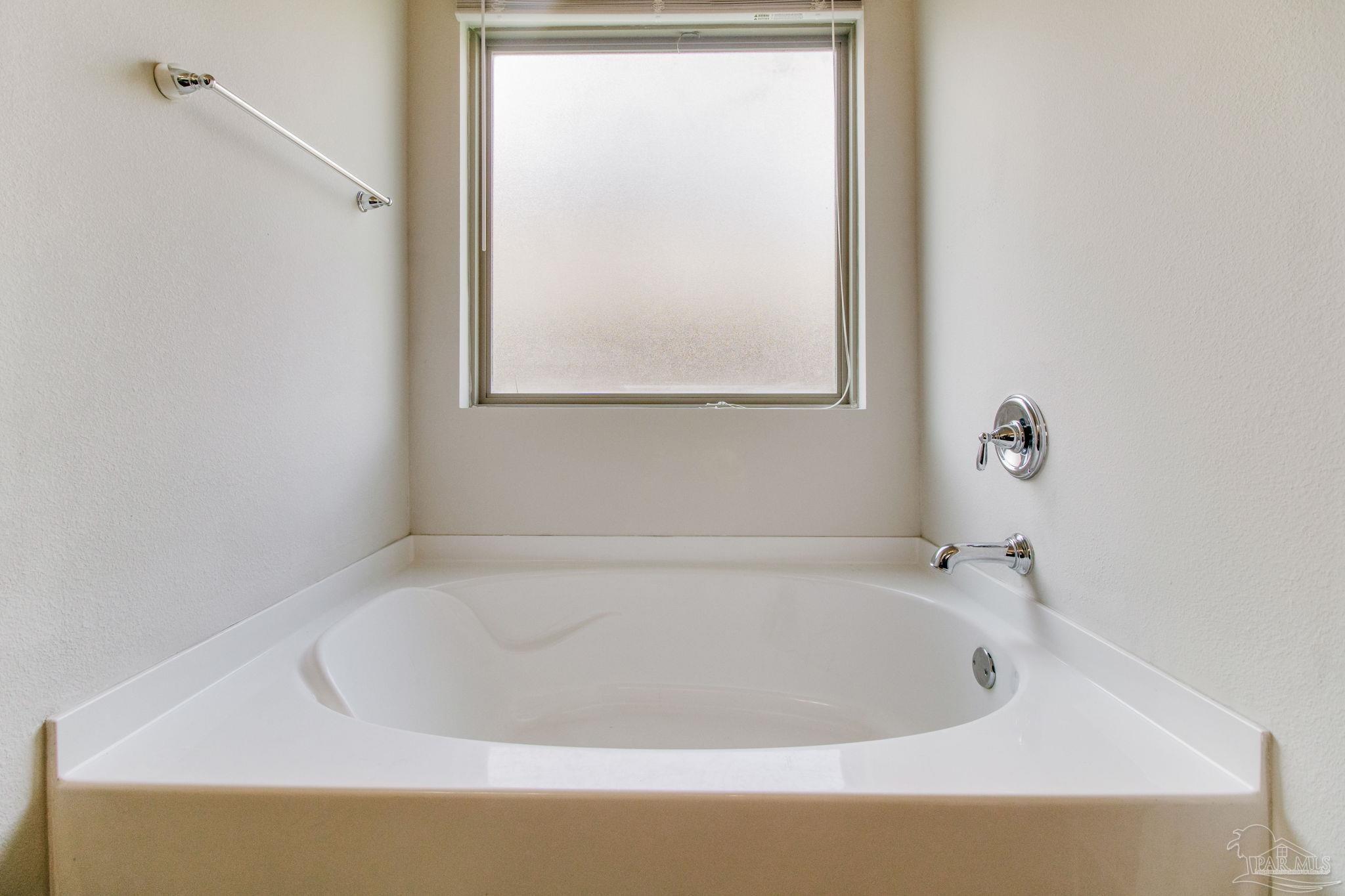 6348 Ladera Trail Pace, FL 32571 - Photo 22 of 50 a white bath tub sitting in a bathroom