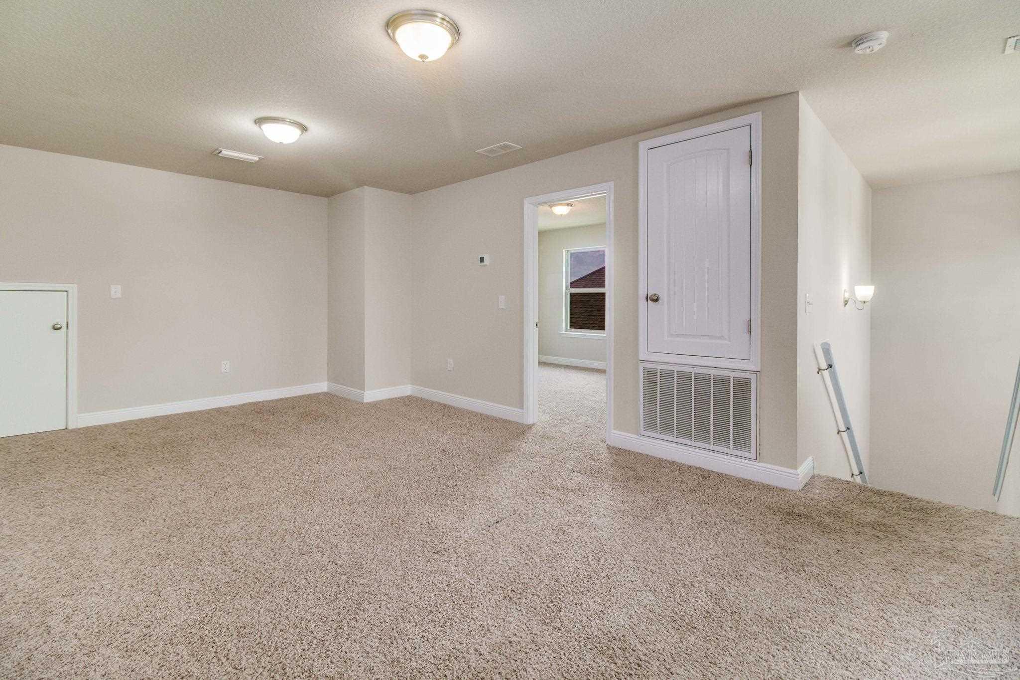 6348 Ladera Trail Pace, FL 32571 - Photo 27 of 50 a view of a livingroom with a staircase