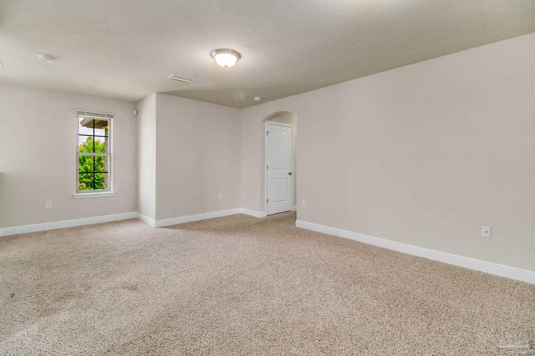 6348 Ladera Trail Pace, FL 32571 - Photo 28 of 50 a view of an empty room with a window