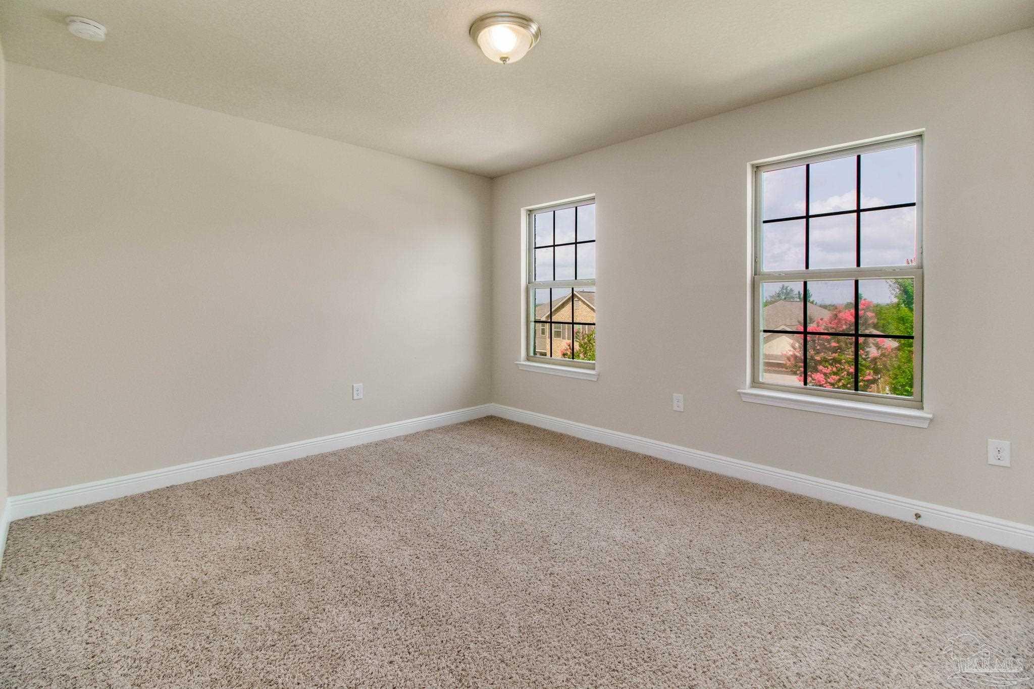 6348 Ladera Trail Pace, FL 32571 - Photo 29 of 50 an empty room with windows