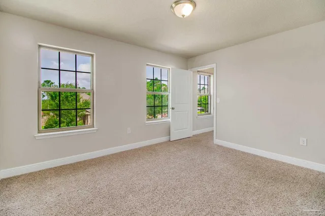 a view of a room with shelf on the wall