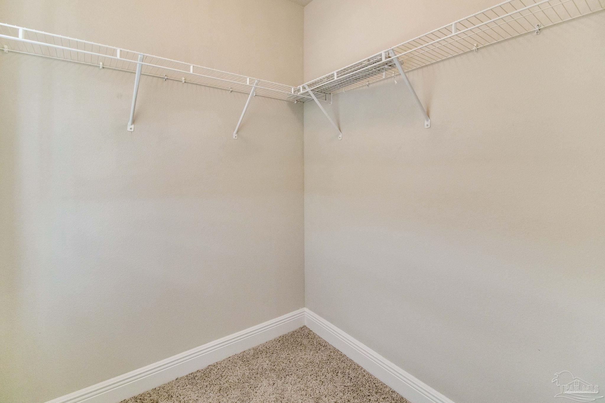 6348 Ladera Trail Pace, FL 32571 - Photo 32 of 50 a view of a room with shelf on the wall