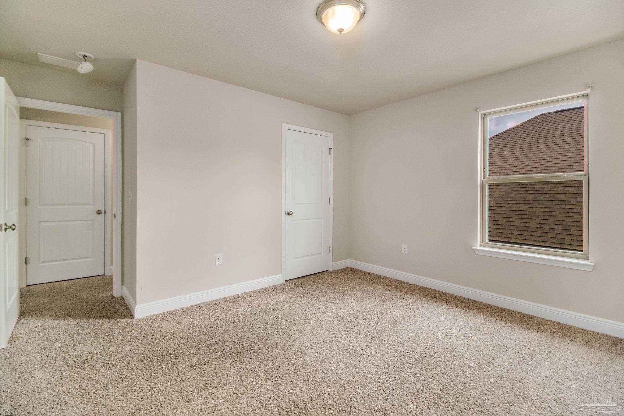 6348 Ladera Trail Pace, FL 32571 - Photo 35 of 50 an empty room with a window