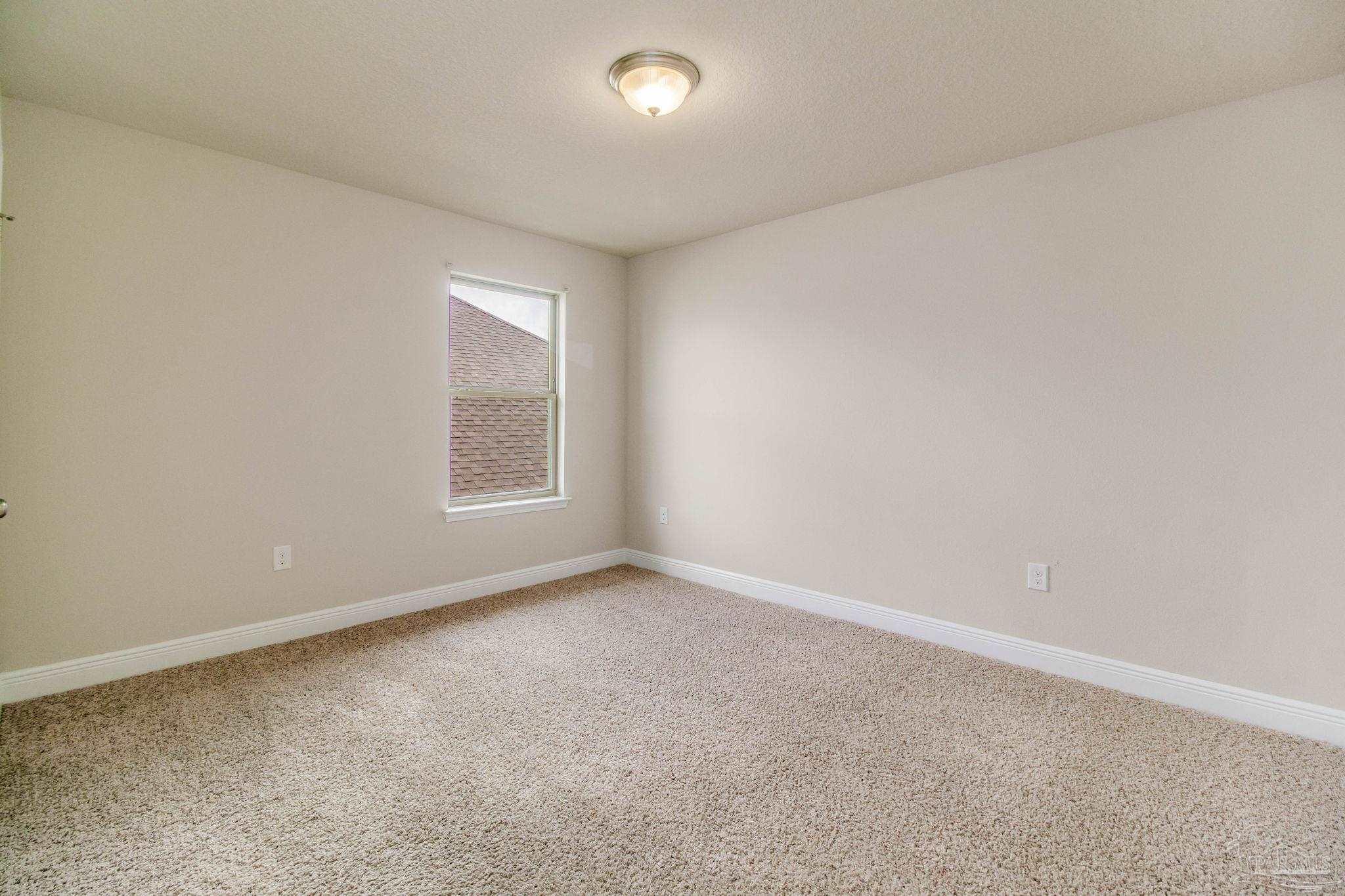 6348 Ladera Trail Pace, FL 32571 - Photo 36 of 50 an empty room with a window