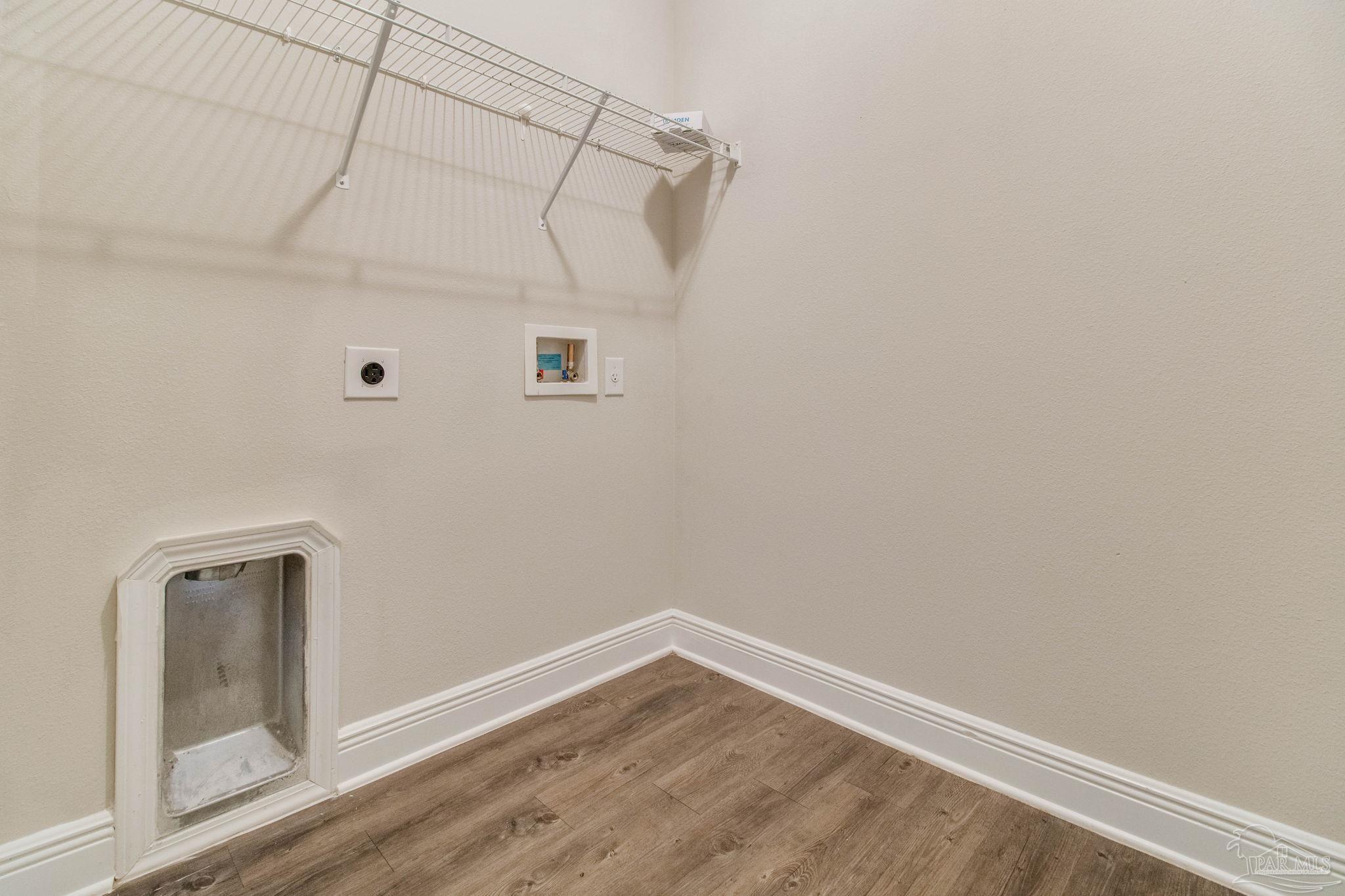 6348 Ladera Trail Pace, FL 32571 - Photo 44 of 50 a view of a room with wooden floor