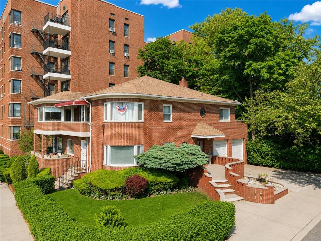 1 Bay Ridge Parkway Brooklyn, NY 11209 - Photo 6 of 38 a front view of a residential apartment building with a yard