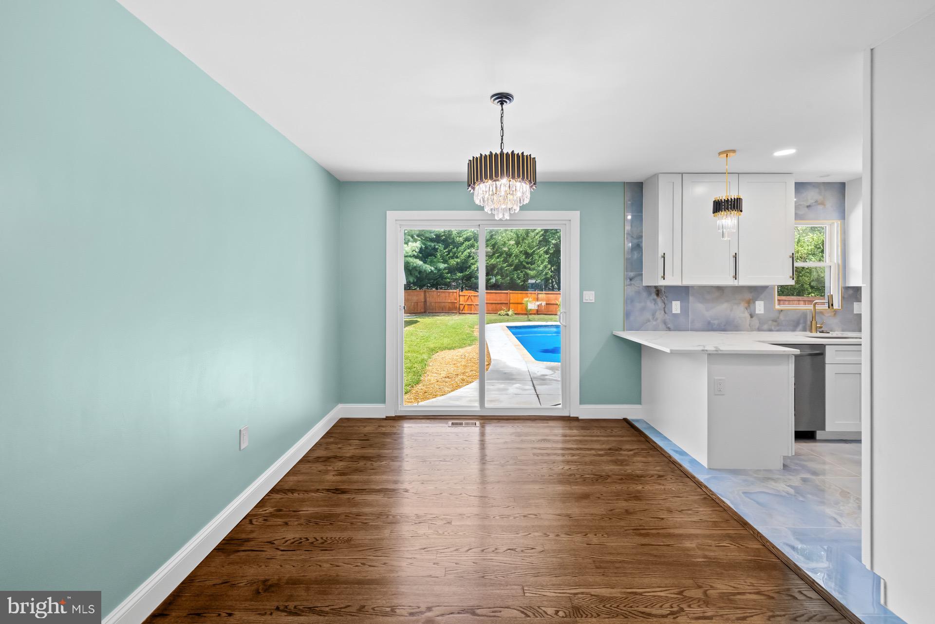 523 Sunset Knoll Road Pasadena, MD 21122 - Photo 17 of 60 a kitchen with stainless steel appliances granite countertop a sink a stove top oven a counter space and cabinets